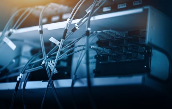 Fibre cable connected to patch. Telecommunication concept.
